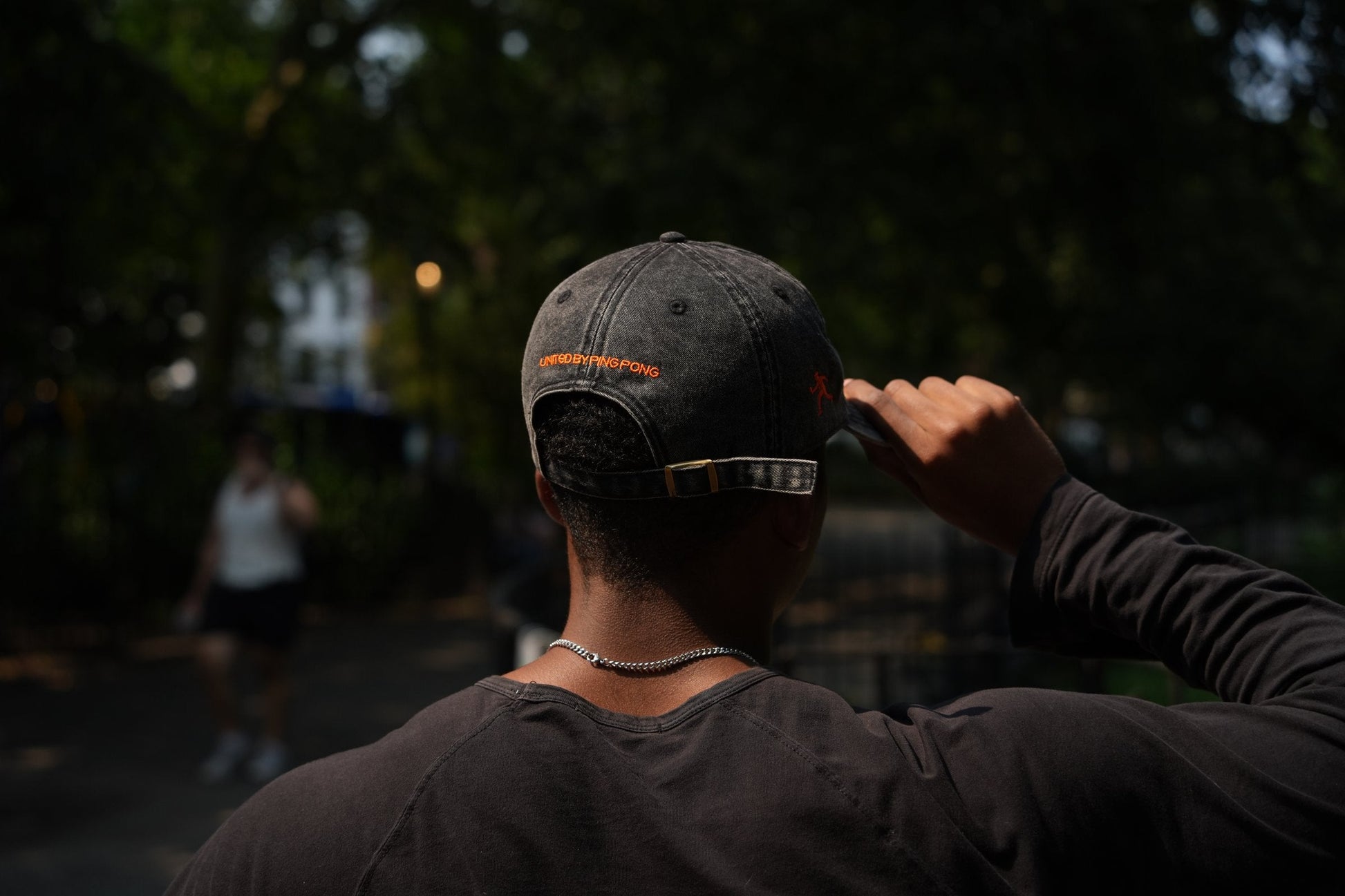 SPIN Club Cap black, UNITED BY PING PONG back arch, worn